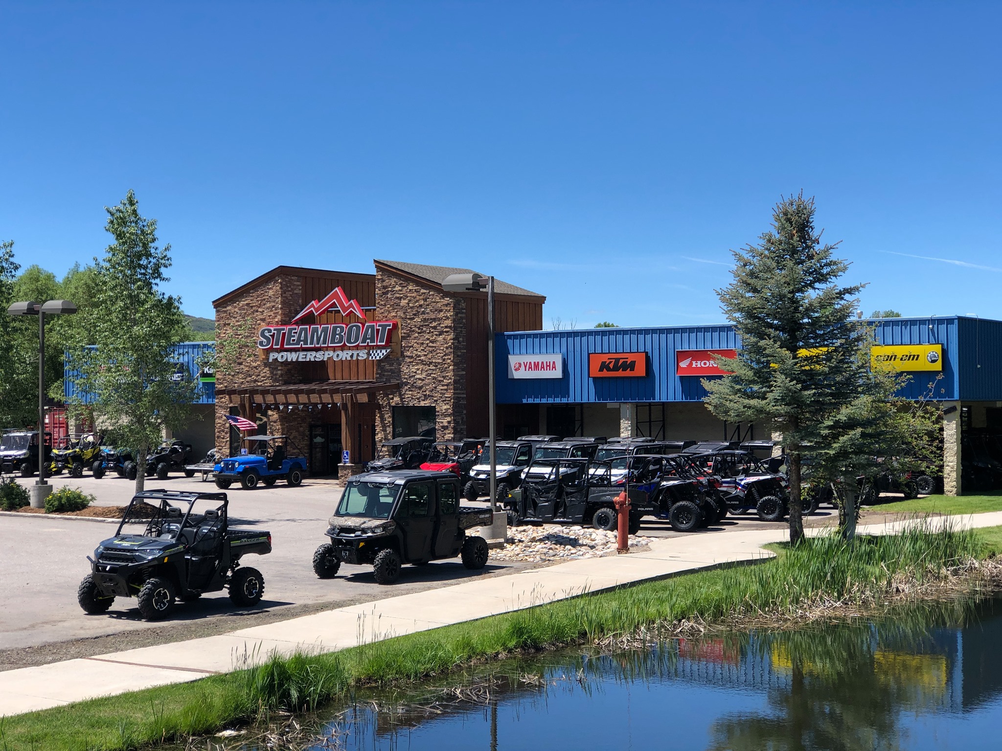 Steamboat Powersports showroom exterior, Riverside Plaza